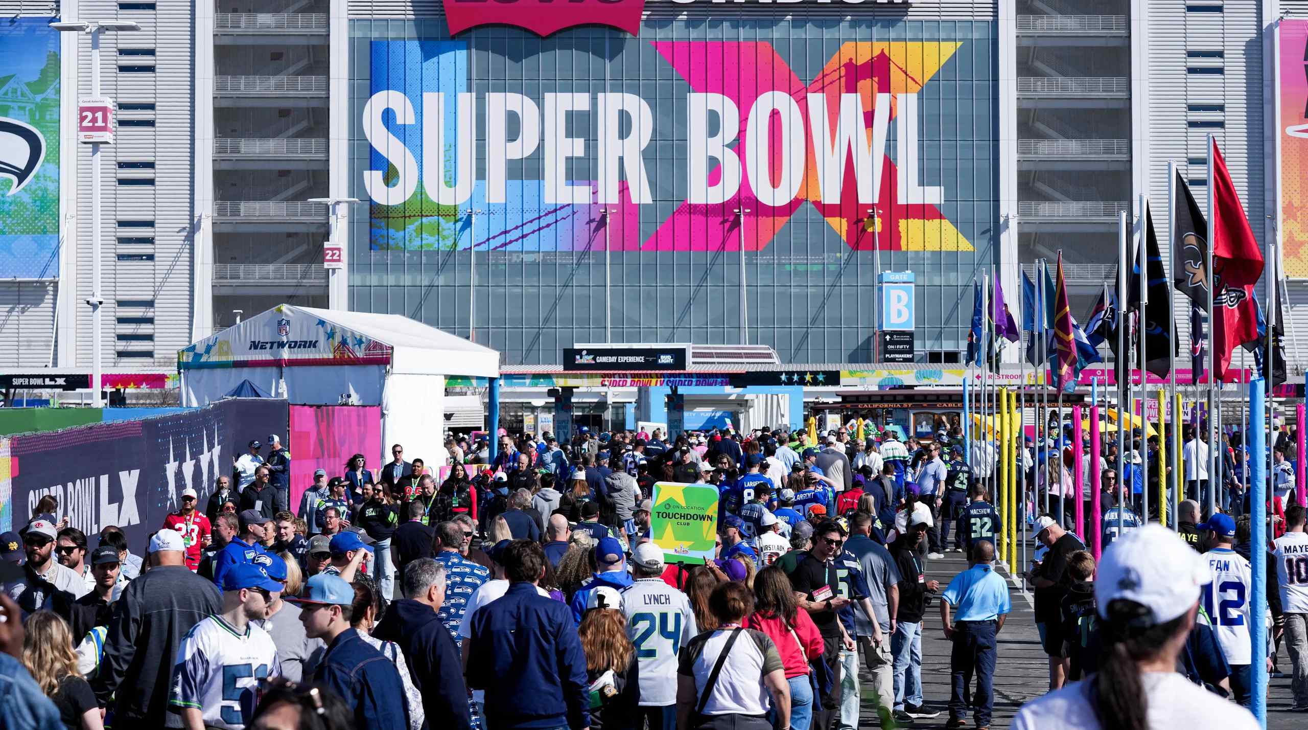 A huge crowd of people waiting for the Super Bowl to begin.